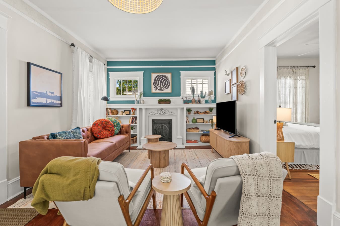 Open living room w/ comfy seating, cheerful accents, & an easy flow for relaxing together.