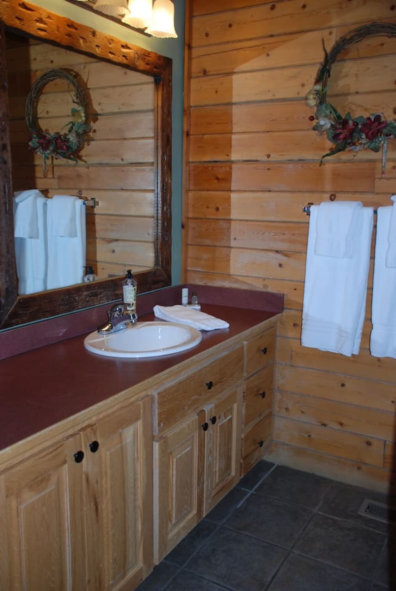 Bathroom with shower and toilet is in separate room.