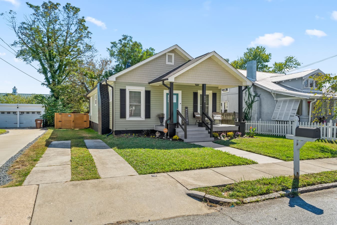 Charming exterior view w/ clean lines, front lawn, & classic curb appeal.