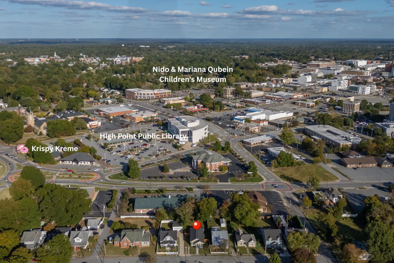 Wide aerial scene showcasing the neighborhood from above.