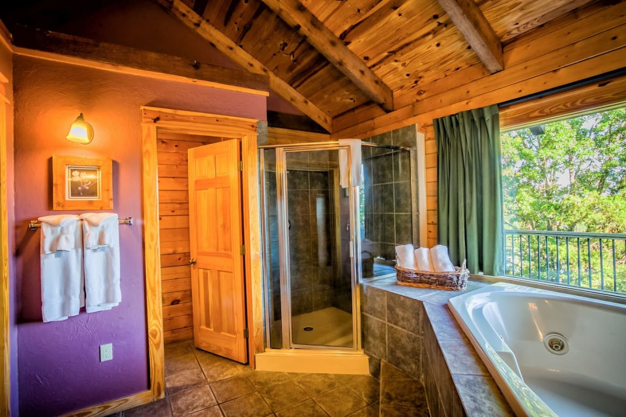 Master Bathroom with shower . Shower has a seat.