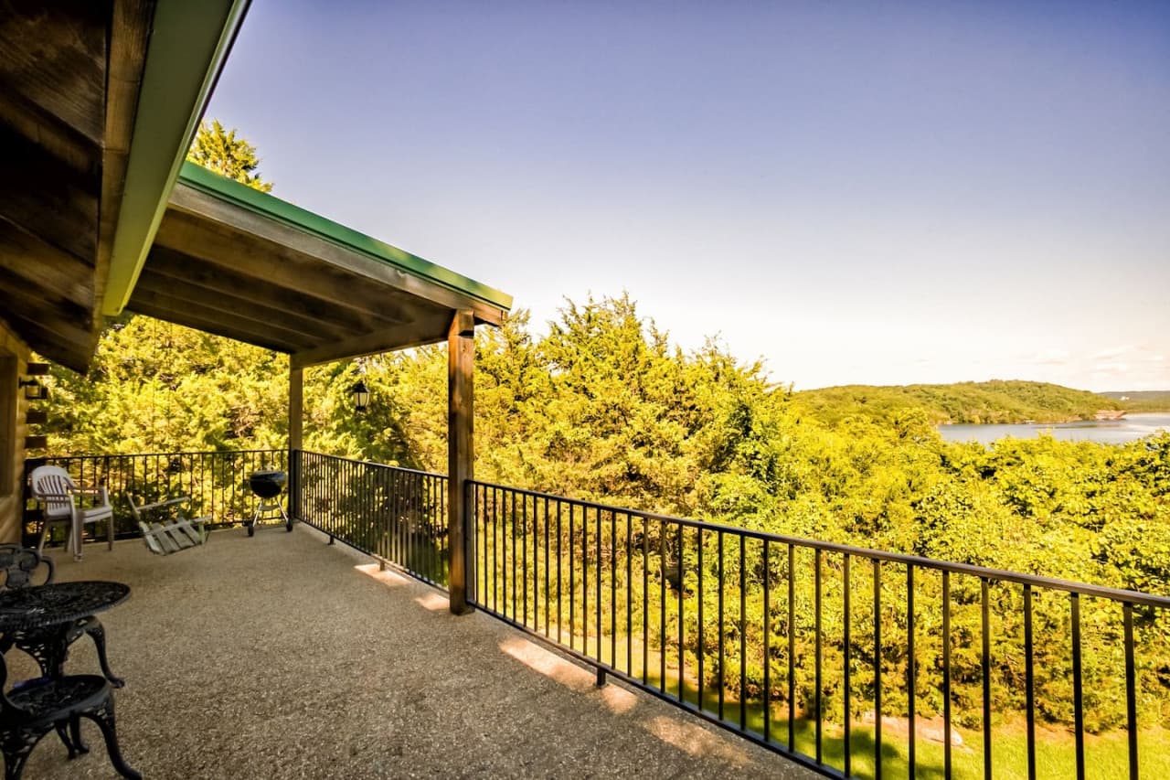 Deck with lake view and porch swing