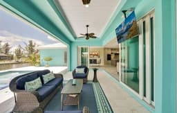 3 Bedroom Home on a Canal with  a Garage and Heated Pool