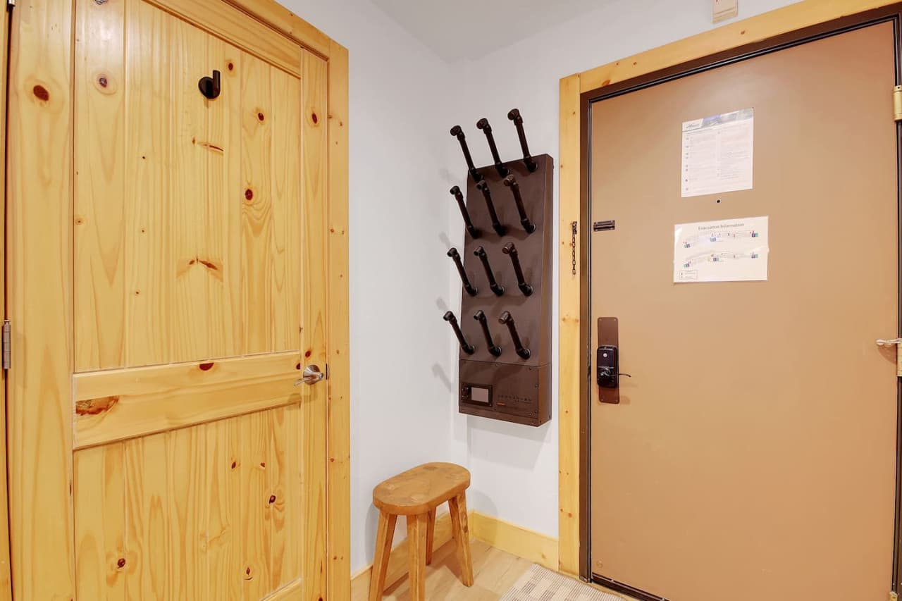 Front entrance with a boot, helmet and glove heated drying rack.