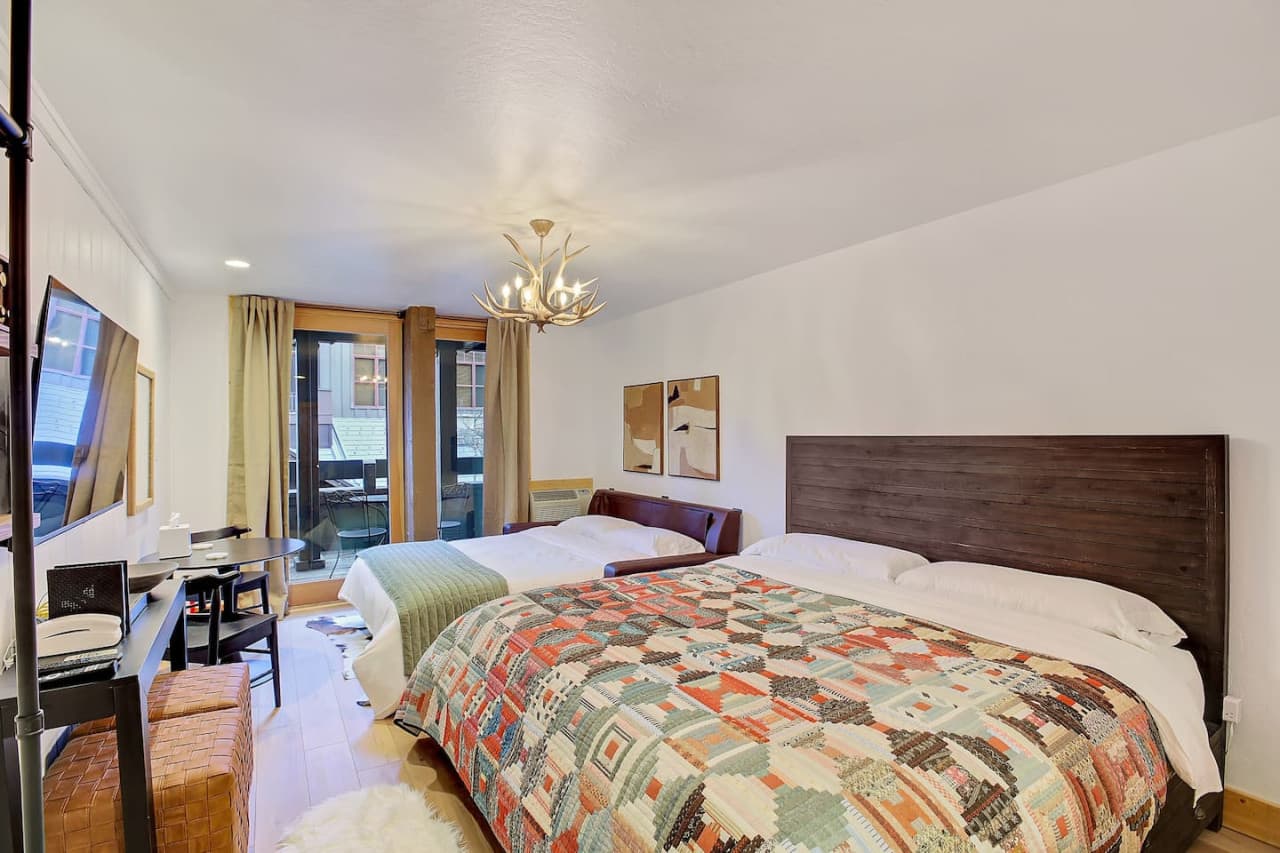 Studio with a King bed (firmness: soft to medium), Queen sofa sleeper, dining table and 50" Smart TV.