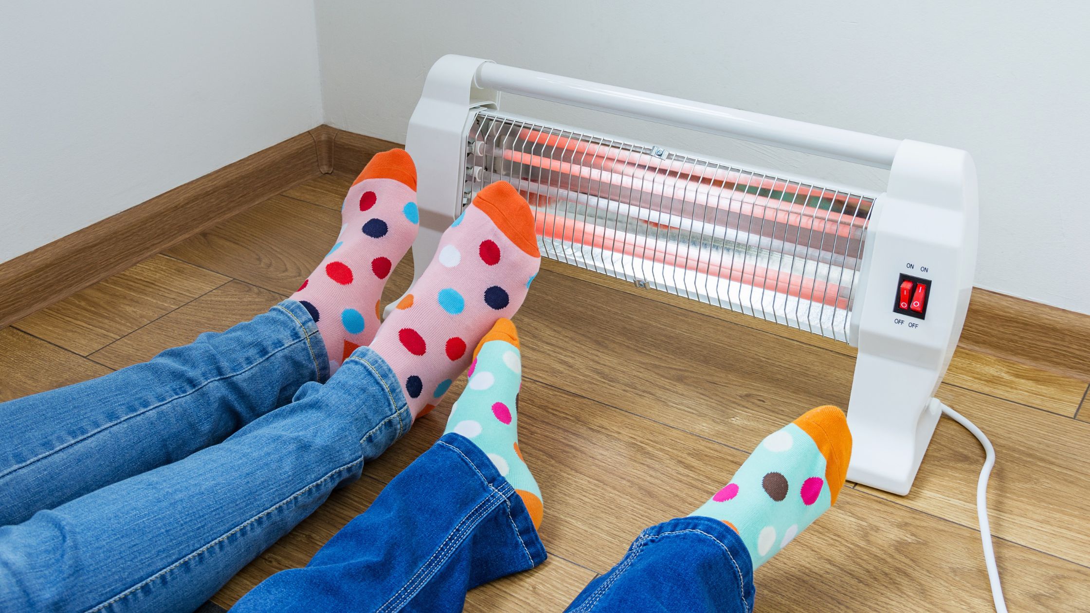 Electric space heater with kids heating up their feet.