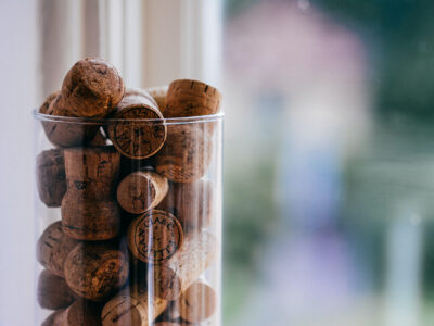 Wine corks in a glass jar as a vacation rental guest book idea.