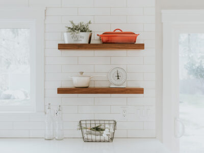 Maximizing space in a white kitchen with vertical storage.